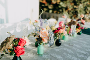 Outdoor St. Pete Tampa Florida Boho Elopement Reception Table Centerpiece with Mint and Black Bud Vases of Blush Pink Roses, Scabiosa, Buttercup, Blue Thistle and Greenery