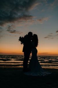 Outdoor Bride and Groom Beach Sunset Portrait at Tampa St Pete Florida COVID Destination Elopement Beach Wedding Ceremony | Amber McWhorter Photography