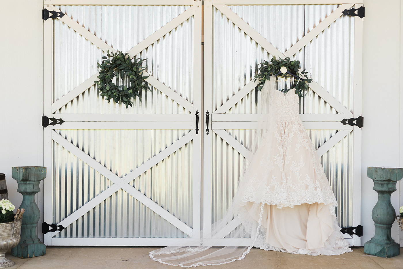 Rustic Inspired Bridal Details, Strapless Lace A A-Line Morilee Wedding Dress Hanging from Steel Barn Door | Florida Wedding Planner and Designer John Campbell Weddings