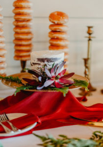 Wedding Dessert Table Donuts Display with Donut Towers from Krispy Kreme | Petite Small WEdding Cake Table with Greenery and Burgundy Red Protea