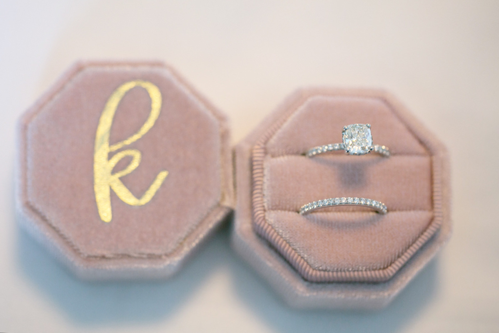 Wedding Ring Shot | Blush Pink Velvet Ring Box with Gold Monogram Initial | Channel Set Diamond Band with Square Cushion Cut Solitaire Diamond Engagement Ring