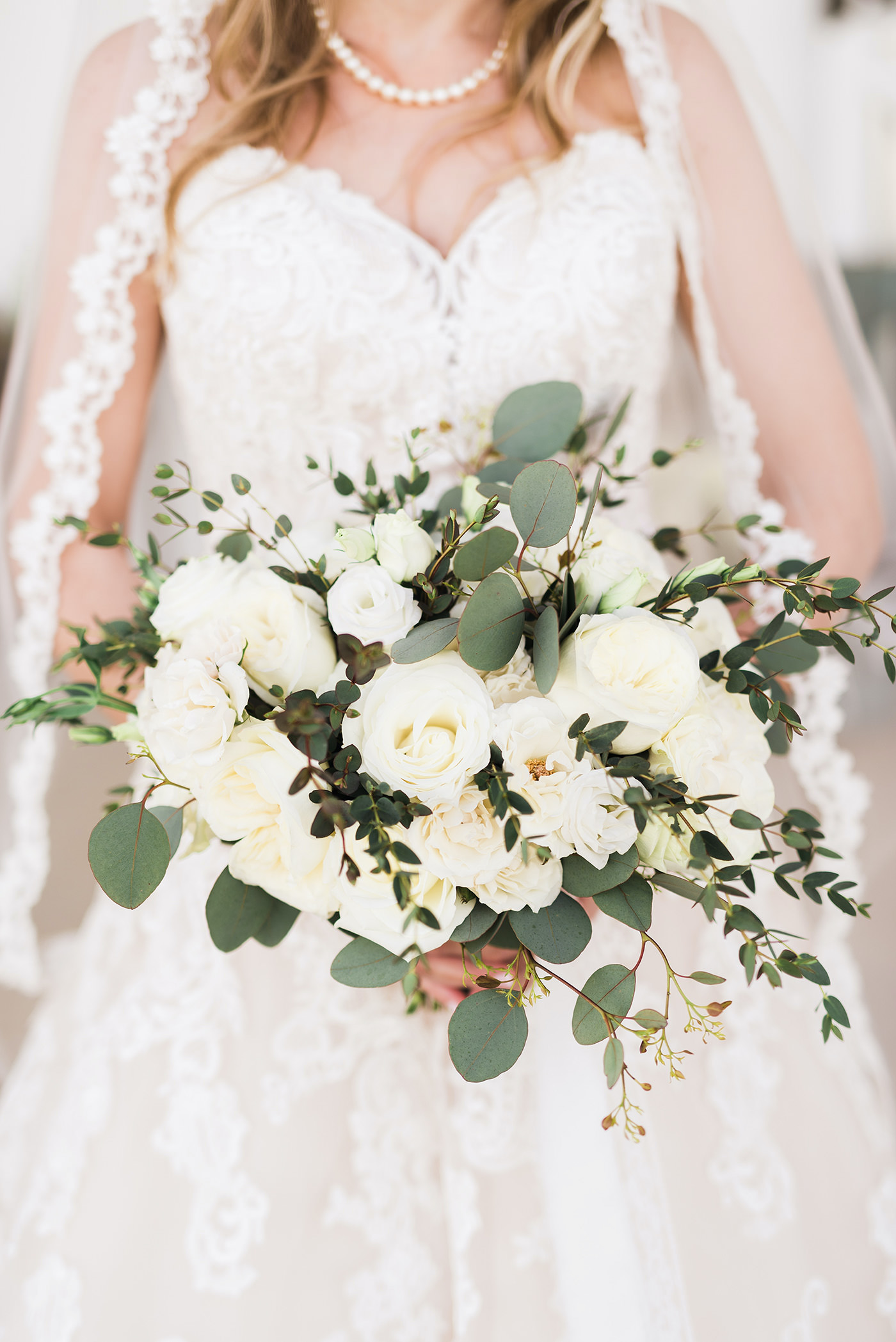 Romantic Florida Bride Holding Round Ivory Rose Wedding Bouquet with Greenery, Bride Wearing Morilee Wedding Dress and Pearl Necklace | Tampa Bay Luxury Wedding Planner and Floral Designer John Campbell Weddings