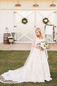 Romantic Florida Bride Holding Round Ivory Rose Wedding Bouquet with Greenery, Bride Wearing Morilee Wedding Dress | Barn at Covington Farm | Tampa Bay Luxury Wedding Planner and Floral Designer John Campbell Weddings