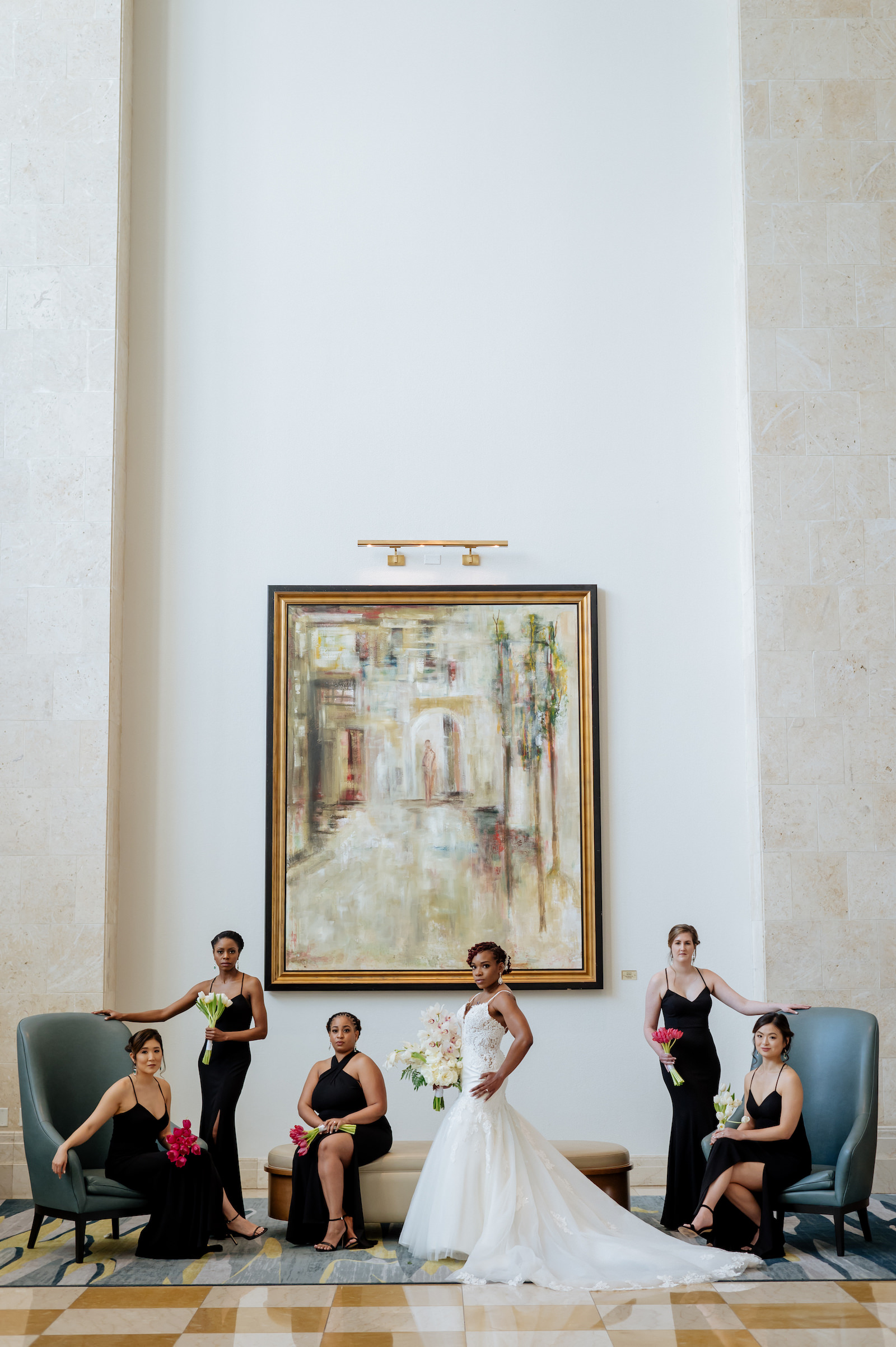 Bride and Bridesmaids Indoor Portrait | Ivory Spaghetti Strap Scoop Back Lace and Tulle Mermaid Martina Liana Wedding Dress Bridal Gown | Black Long Jenny Yoo Bridesmaid Dresses from Tampa Dress Shop Bella Bridesmaids