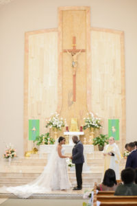 Tampa Bay Bride and Groom Exchange Vows in Church Ceremony | Florida Wedding Photographer Lifelong Photography Studio | Traditional Wedding Venue St. John Vianney Catholic Church