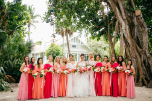 Tropical Vibrant Bride and Bridesmaids in Pink and Coral Dresses