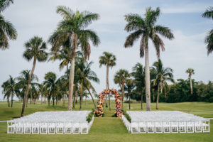 Tropical Wedding Ceremony Decor, Colorful Pink and Coral Floral Arch | Boca Grande Wedding Venue Gasparilla Inn | Tampa Bay Wedding Planner NK Weddings