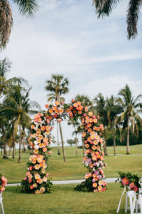 Tropical Wedding Ceremony Decor, Pink and Coral Lush Floral Arch | Boca Grande Wedding Venue Gasparilla Inn | Tampa Bay Wedding Planner NK Weddings