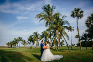 Tropical Tampa Bride and Groom on Golf Course at Boca Grande Wedding Venue Gasparilla Inn