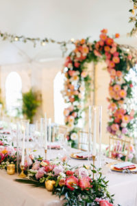Elegant Tropical Wedding Reception Decor, Lush Pink and Coral with Greenery Floral Table Runner, Gold Candlesticks | Tampa Bay Wedding Planner NK Weddings