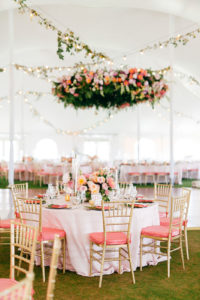 Elegant Tropical Tent Wedding Reception Decor, Tables with White Linens, Gold Chiavari Chairs with Pink Cushions, Hanging Floral Draping | Tampa Bay Wedding Planner NK Weddings