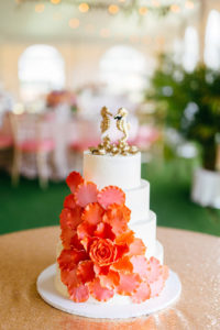 Tropical Elegant Four Tier White Wedding Cake with Coral Sugar Flowers Cascading