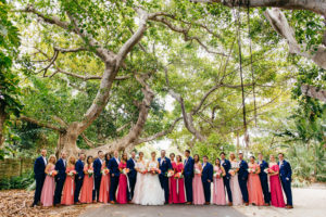 Tropical Colorful Wedding Party, Bridesmaids in Pink and Coral Dresses, Groomsmen in Navy Blue Suits
