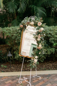 Wedding Ceremony Decor, Elegant Romantic Gold Frame Mirror Welcome Sign with Greenery Garland and Ivory and Blush Pink Roses | Florida Wedding Venue Renaissance Vinoy Tea Garden | Tampa Bay Wedding Planner Parties A’La Carte