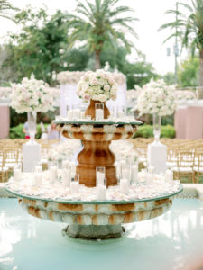 Tampa Bay Luxury Outdoor Wedding Ceremony at The Tea Garden at The Vinoy Renaissance, Historic Fountain Decorated with Lush Ivory Florals and Candles | Florida Wedding Planner Parties A’La Carte