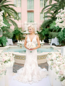 St. Petersburg Bridal Portrait, Romantic Modern Bride Wearing Fit and Flare Lace Eve of Milady Kleinfeld Bridal Dress, Holding Romantic Rose Bouquet with Ivory and Blush Pink Flowers | Tampa Bay Wedding Planner Parties A'La Carte | Tea Garden Ceremony at Florida Wedding Venue and Historic Resort The Renaissance Vinoy in Downtown St. Petersburg