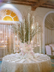 Elegant Florida Wedding Reception Decor, Circular Seating Card Table with Tall Floral Centerpiece, Nature Inspired Decorations with Twigs and Branches, White Flowers, Blush Pink Roses, and Candlelights Hanging, Champagne Linens | Tampa Bay Wedding Planner Parties A La Carte | Downtown St. Petersburg Wedding Venue and Historic Resort The Renaissance Vinoy