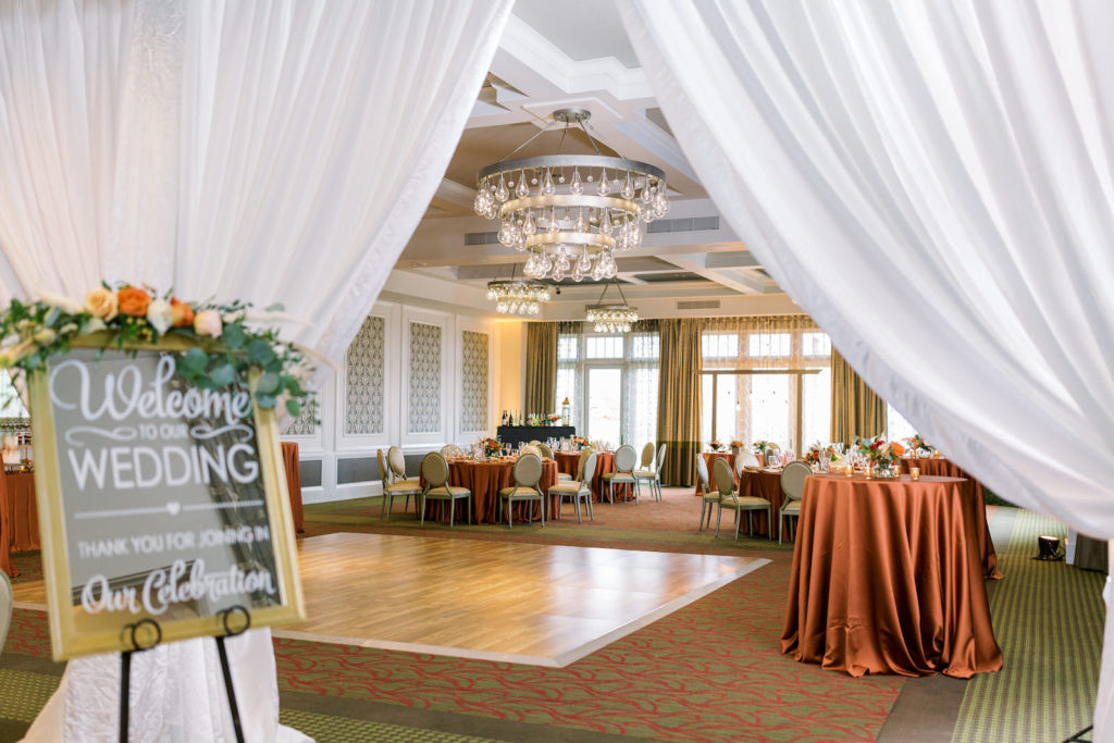 St. Pete Wedding Venue The Birchwood | Intimate Micro Wedding Elopement COVID Styled Shoot | Fall Autumn Wedding Inspiration | Indoor Hotel Ballroom Reception with Mirror Welcome Sign | Orange Copper Wedding Table Linens | Breezin' Weddings