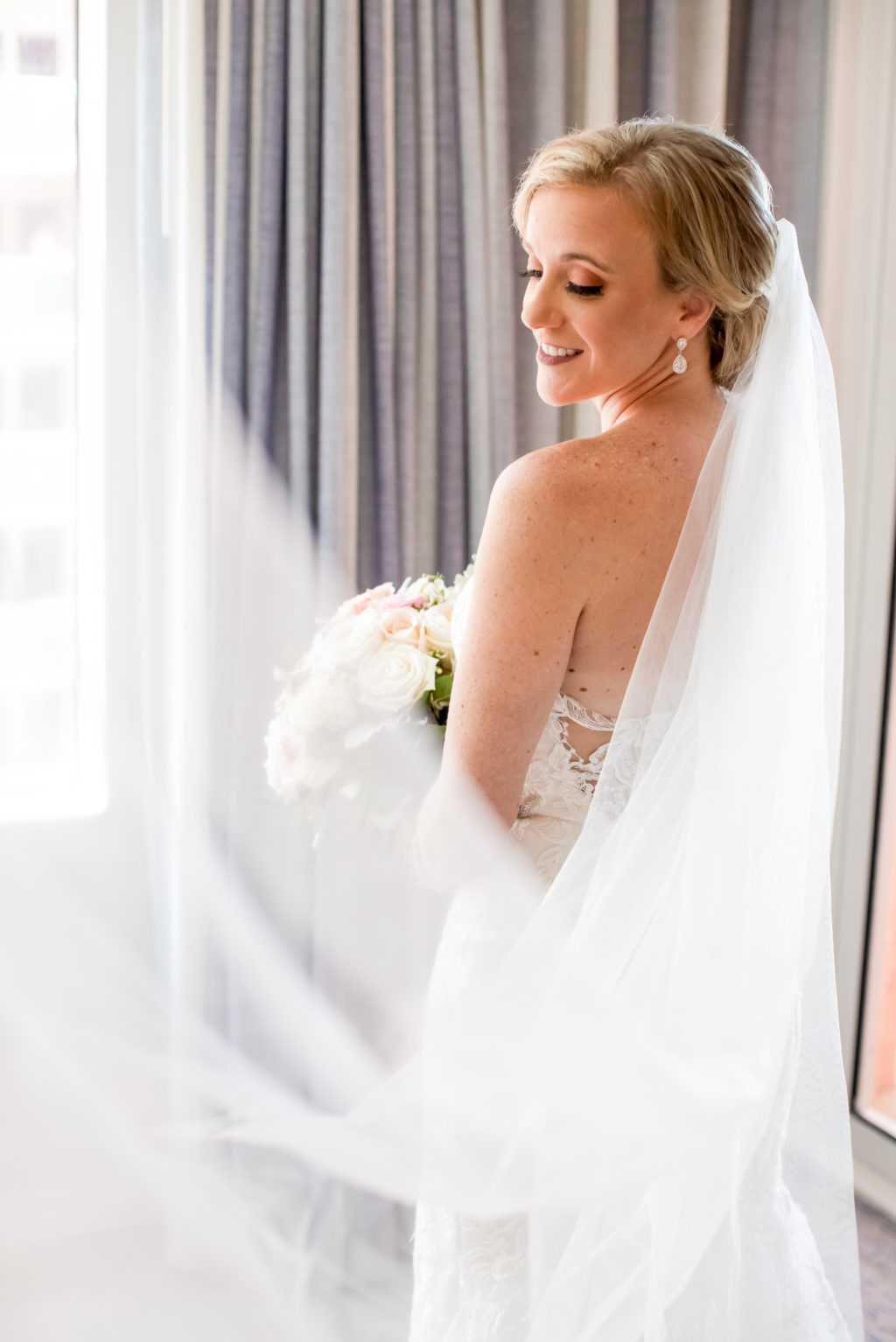Indoor Bridal Portrait Veil Shot | White and Blush Pink Rose Bridal Wedding Bouquet | Classic Chignon Bridal Hair Style