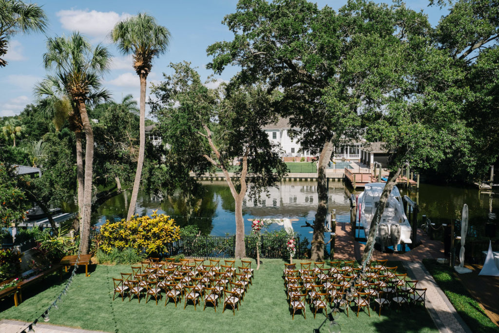 Tampa Bay Waterfront Private Residence Backyard Wedding Ceremony, Farmhouse Chair Rentals, Floral Arch | Florida Wedding Planner and Coordinator Breezin' Weddings | South Tampa Beach Park