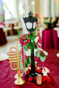 Clearwater Florida Disney Fairy Tale Wedding Reception Centerpiece Princess and the Frog New Orleans Lantern and Trumpet with Greenery and Amaranthus