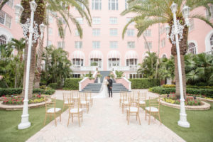 Bride and Groom in Courtyard of St. Petersburg Historic Wedding Venue The Pink Palace, Don Cesar | Tampa Bay Wedding Planner Elegant Affairs by Design | Styled Shoot
