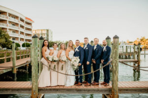 St. Petersburg Bridal Party on Dock, Groomsmen in Navy Blue Suits, Bridesmaids in Beige Matching Dresses | Boutique Hotel Wedding Venue Hotel Zamora