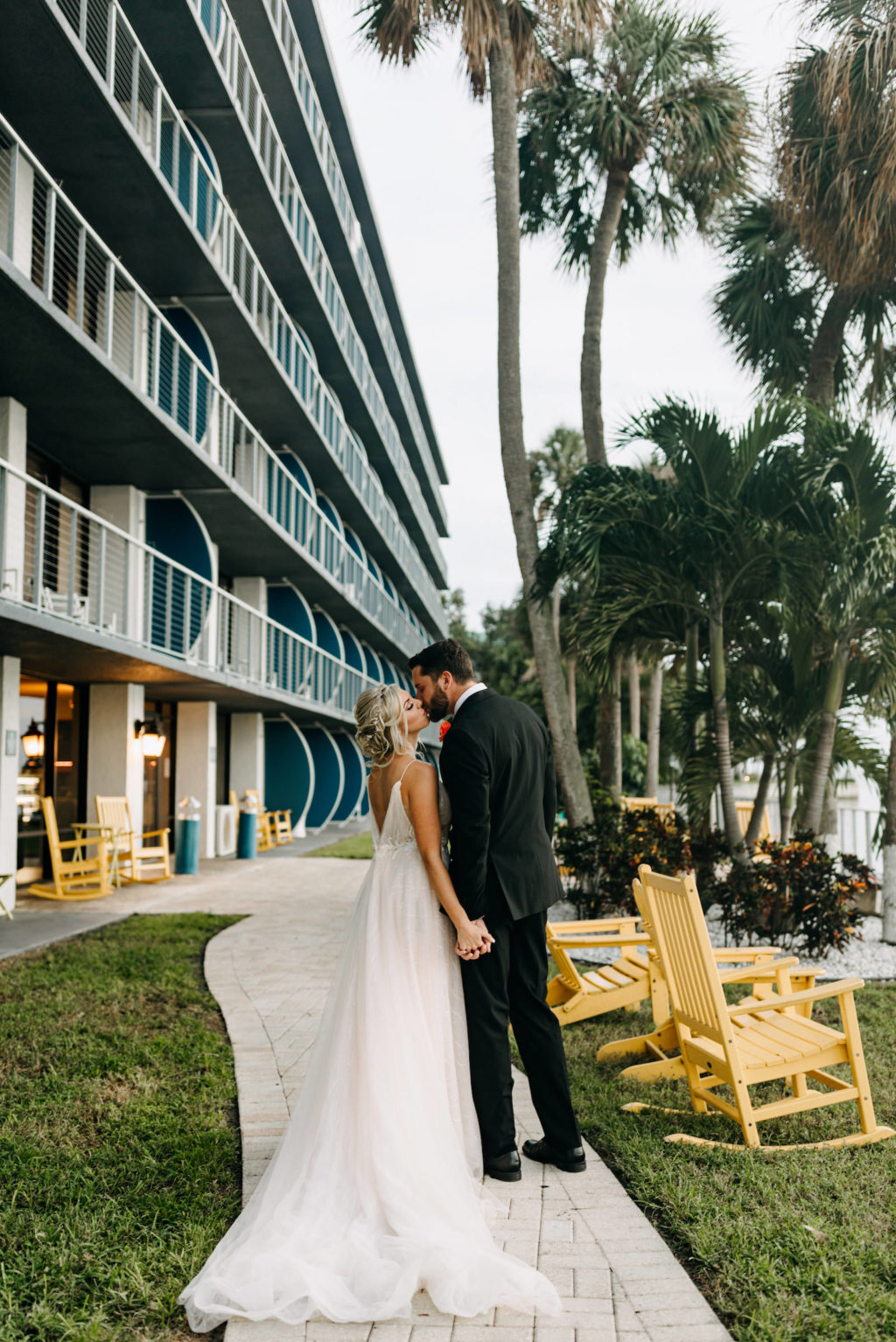 Tampa Bay Bride and Groom in Tropical Modern Wedding Tampa Bay Wedding Venue The Godfrey | Wedding Florist Brides N Blooms | Wedding Planner Elope Tampa Bay | Wedding Dress NIkki's Glitz and Glam | Florida Wedding Hair and Makeup Femme Akoi Beauty Studio | Amber McWhorter Photography