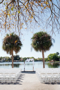 Florida Waterfront Wedding Ceremony, Lakeside Ceremony with Wooden Arch and White Draping | Tampa Bay Wedding Day of Coordinator Special Moments Event Planning | Florida Wedding Venue St. Petersburg Women's Club | Grind & Press Photography