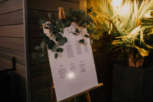 Modern White Seating Chart with Eucalyptus Greenery Arrangement | Tampa Bay Wedding Planner Coastal Coordinating