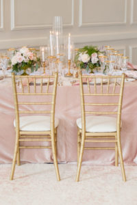 Romantic, Classic Wedding Reception Decor, Gold Chiavari Chairs with Ivory Cushions, Blush Pink Linens, Greenery and Ivory Roses Bouquets, Gold Candlesticks | Tampa Bay Wedding Planner Elegant Affairs by Design | Table Design Kate Ryan Event Rentals | St. Petersburg Historic Wedding Venue Pink Palace, Don Cesar | Styled Shoot