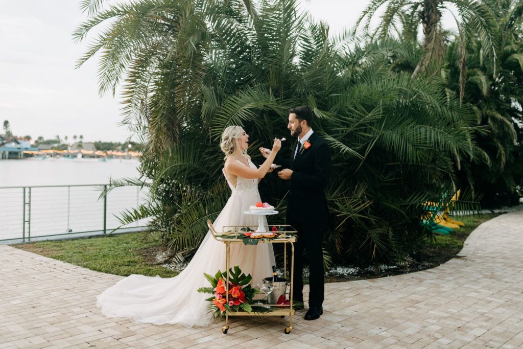 Tropical Inspired Intimate Wedding Reception Decor For Dessert Table, Green Monstera Leaf Table Runner on Bar Car with Vibrant Pink and Orange Roses, Key Lime Pie with Champagne, Custom We Eloped Mini Pies| Florida Wedding and Elopement Planner Elope Tampa Bay | The Godfrey Hotel | Amber McWhorter Photography