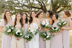 Classic Bride with Bridesmaids in Neutral Taupe Mix and Match Dresses Holding Tropical White Floral Bouquets | Tampa Bay Wedding Florist and Designer John Campbell Weddings