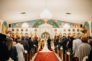 Traditional bride and groom exchanging wedding vows during ceremony | St. Petersburg Wedding Venue St. Stefanos Greek Church