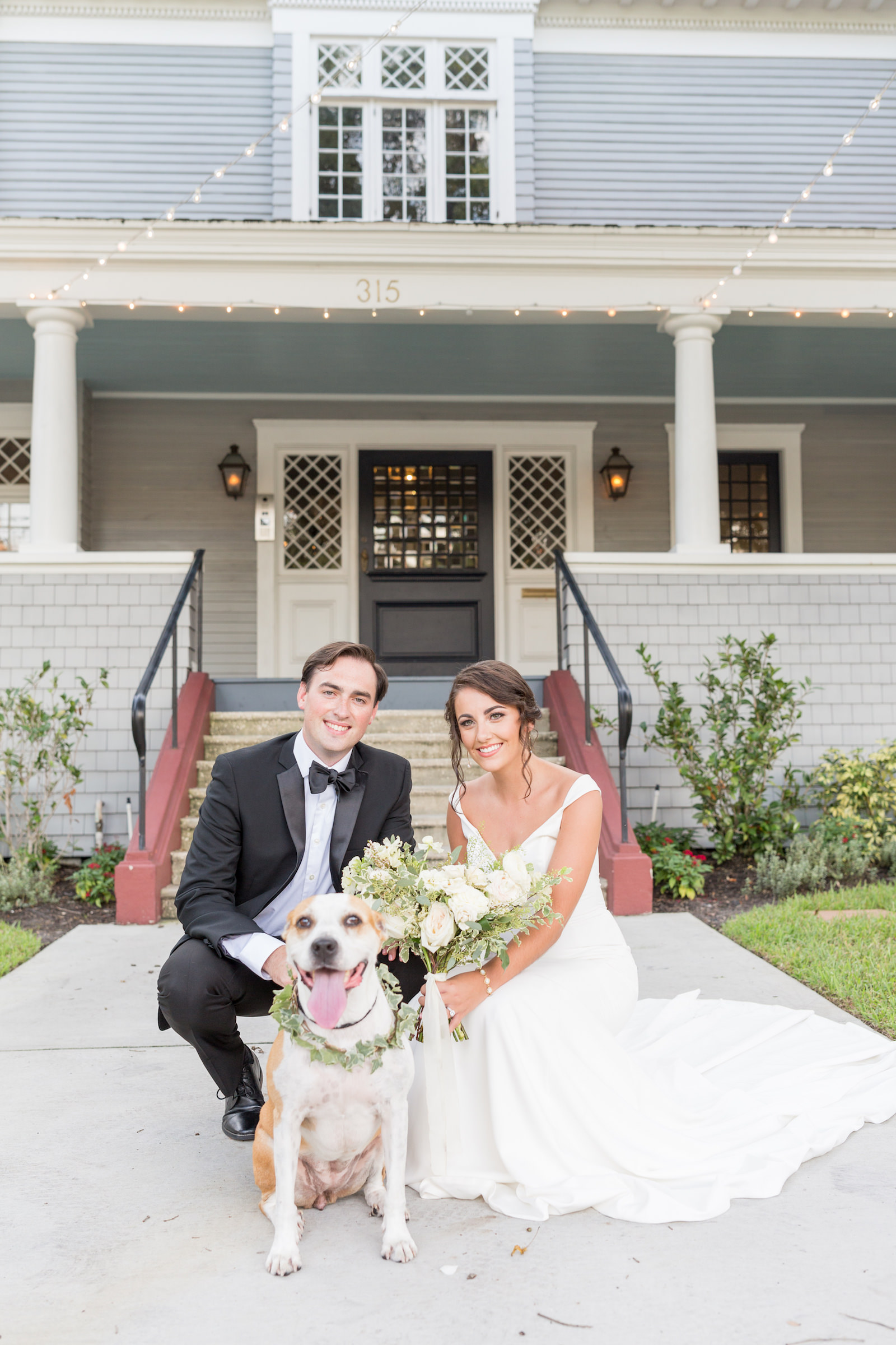 Classic and timeless bride and groom outside with dog, historic Tampa wedding venue The Orlo | Wedding pet planner FairyTail Pet Care