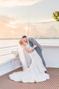Bride and Groom Outdoor Waterfront Sunset Kiss Portrait Boat Ship Deck at Tampa Wedding Venue Yacht Starship