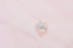 COVID Blush Tampa Wedding Photography Ring Shot | Diamond Halo Round Engagement Ring with Channel Set Band
