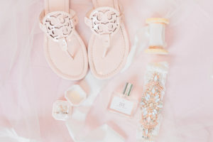 COVID Wedding Flat Lay Bridal Accessories | Blush Pink Tory Burch Sandals and Velvet Ring Box with Ribbon Sash