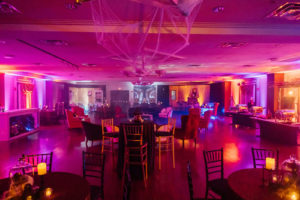 Halloween Wedding Reception Decor, Purple Uplighting, Cobwebs on Ceiling, Chiavari Chairs | Tampa Bay Wedding Planner UNIQUE Weddings and Events | Wedding Chair Rentals A Chair Affair | Wedding Rental Over the Top Rental Linens
