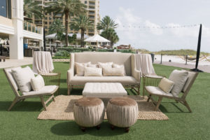 Garden-style beachside wedding reception decor, linen couch lounge seating, velvet round pouff seats | Tampa Bay wedding planner Parties A'la Carte | Clearwater Beach wedding venue Sandpearl Resort