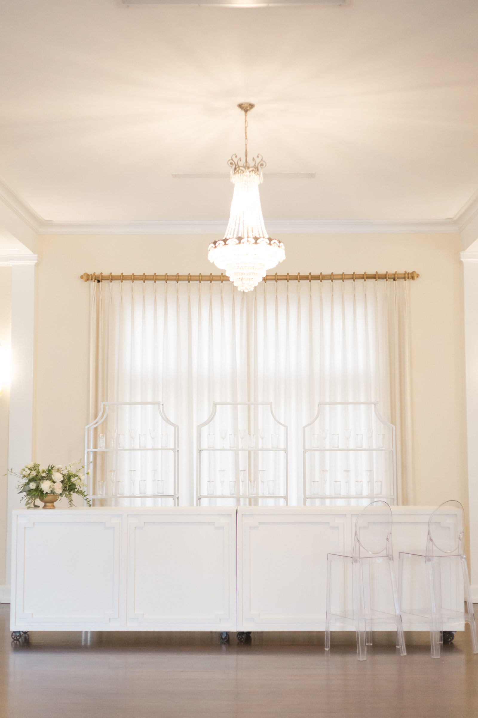 Classic and timeless wedding reception decor, white bar, ghost chairs | Tampa Bay wedding planner and design Elegant Affairs by Design | Kate Ryan Event Rentals