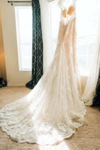 Wedding Gown Hanger Shot at Window | Lace A Line Martina Liana Illusion Bridal Gown Dress