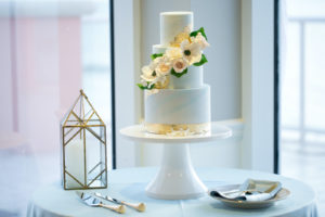 Elegant Modern Three Tier Blue and Gold Foil Wedding Cake with White Flowers | Tampa Bay Wedding Photographer Carrie Wildes | Tampa Bay Cake Company | Wedding Rentals Outside the Box | Wedding Planner Coastal Coordinating