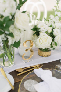 Garden-style classic wedding reception decor, gold acrylic laser cut table number, low floral centerpieces white roses, gold flatware | Tampa Bay Wedding Planner Parties A'la Carte | Kate Ryan Event Rentals