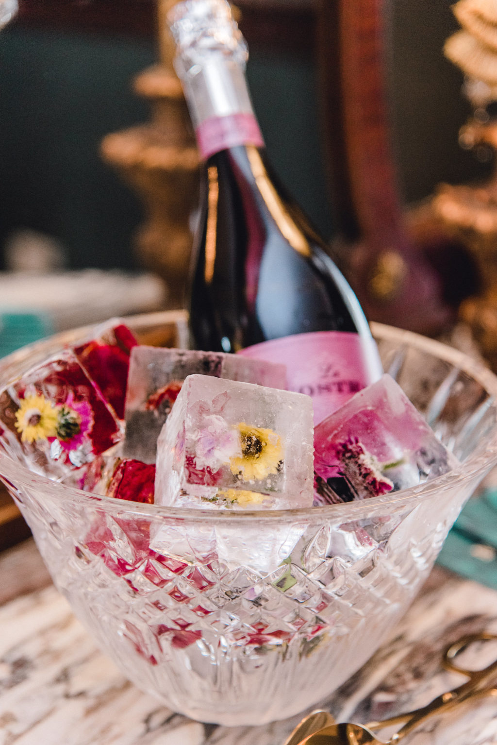 Whimsical Unique Flowers in Ice Cubes and Bottle of Champagne | Tampa Bay Wedding Planner EventFull Weddings
