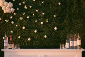 Elegant Modern Wedding Reception Decor, Greenery Wall with White Flowers, White Bar with Custom Acrylic Menu | Tampa Bay Wedding Planner Coastal Coordinating | Wedding Photographer Carrie Wildes | Wedding Rentals Outside the Box