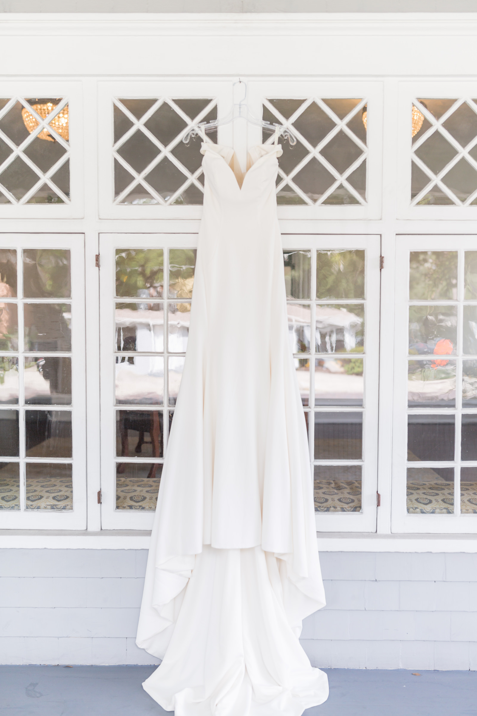 Classic v neckline wedding dress hanging