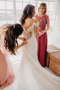 Florida Bride Getting Dress on with Bridesmaid and Mother, Maggie Sottero Lace Illusion and Cap Sleeve Wedding Dress | Tampa Bay Wedding Hair and Makeup Artist Michele Renee the Studio