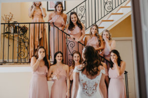 Florida Bride First Look with Bridesmaids in Mix and Match Pink Dresses | Tampa Bay Hair and Makeup Michele Renee the Studio