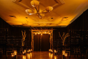 Whimsical Halloween Wedding Ceremony Decor, Tree Branches Arch, Black Candles in Hurricane Candle Holders | Tampa Bay Wedding Planner UNIQUE Weddings and Events | Wedding Rentals A Chair Affair